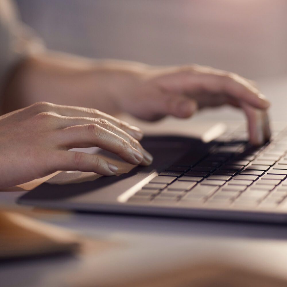 Woman typing on laptop